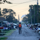 A man walks past debris from damaged homes after Hurricane Harvey in Port Arthur, Texas. Photo: AP
